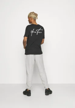 YOURTURN UnisexPantaloni SportiviMottled Light Grey Donna Pantaloni YO121004Q-C11 -Yourturn 44af697d8af34693a7b3385401313f6d scaled