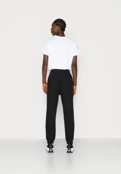 YOURTURN UnisexPantaloni SportiviBlack Donna Pantaloni YO12100OR-Q11 -Yourturn 93239351f3ae4382bd2bf96cade29d39 scaled